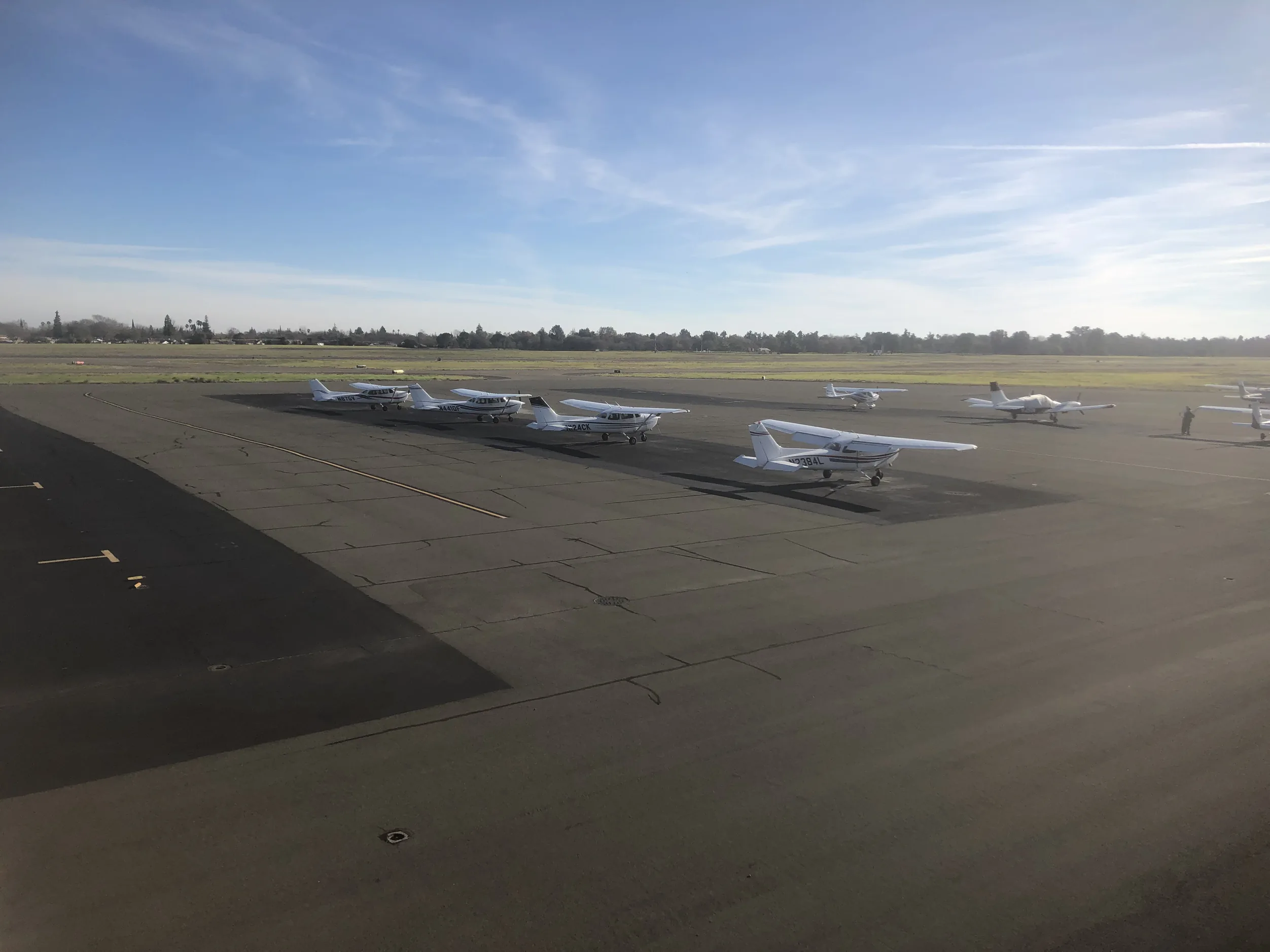 AIAA training aircraft lined up on the apron