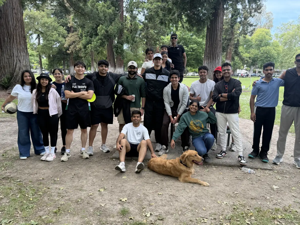 AIAA students gathered for a group photo on a park afternoon